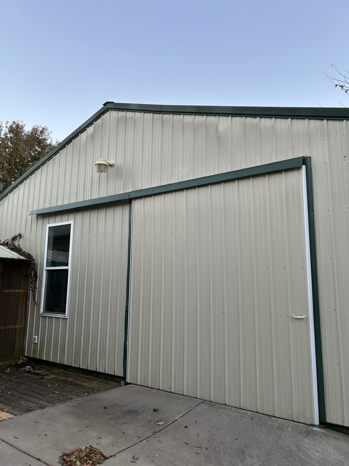 Before: Metal building exterior wash