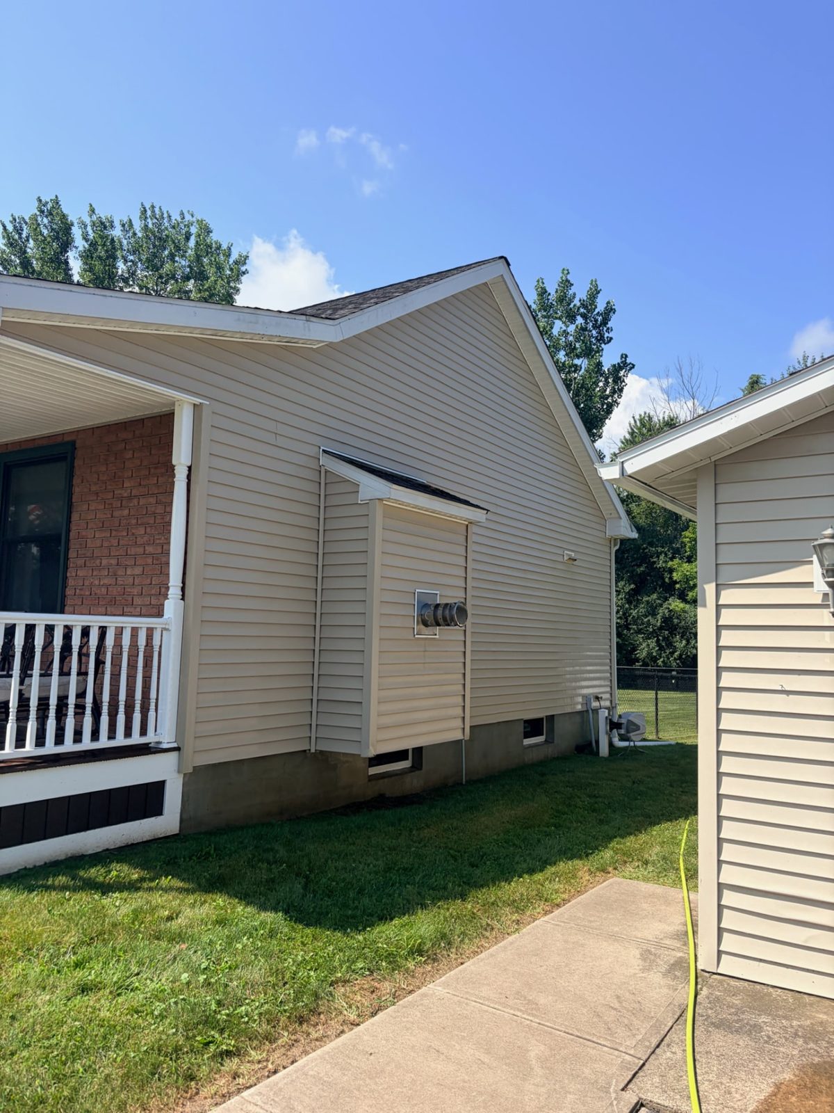 After: Two-story siding soft wash